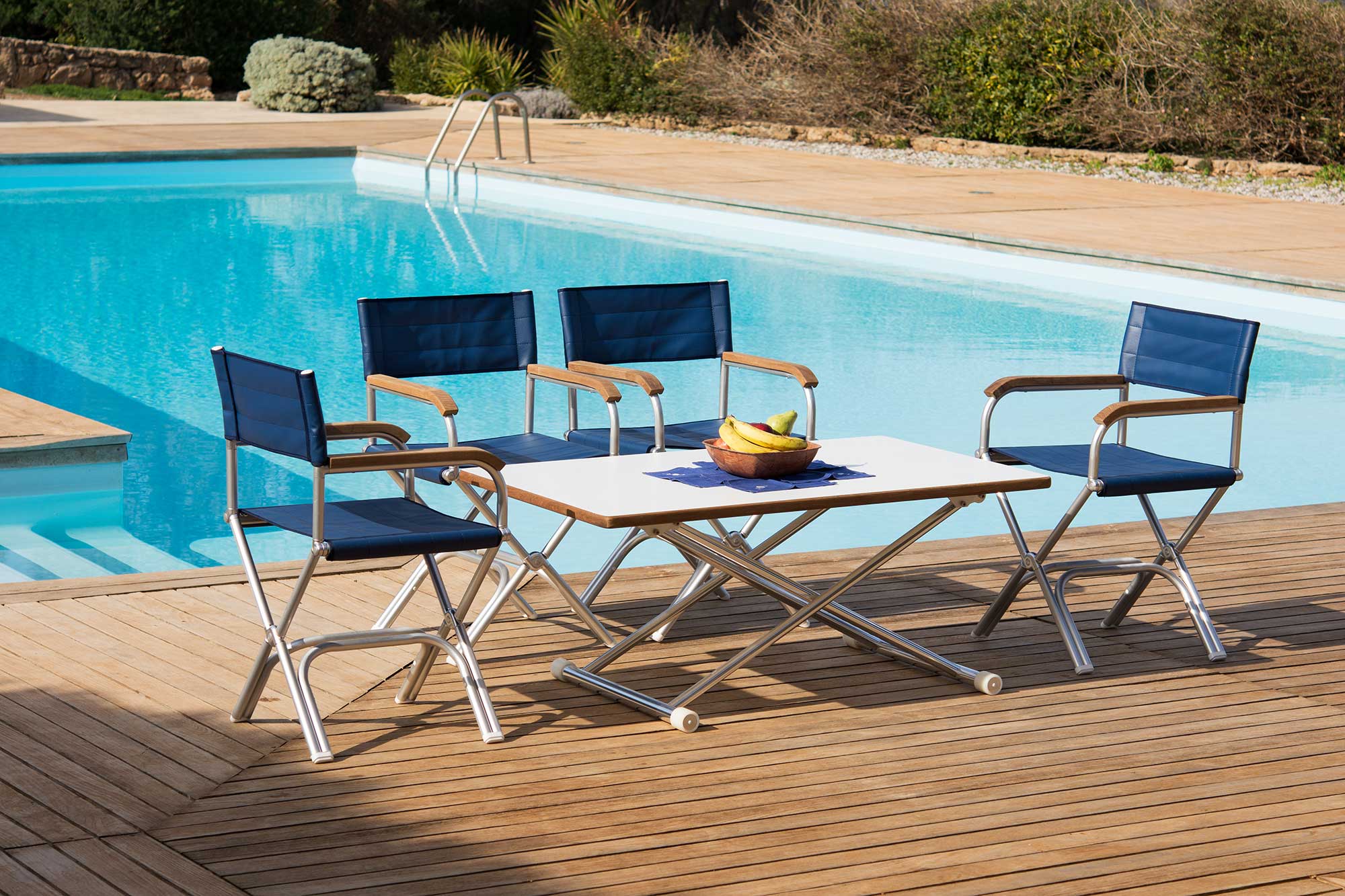 FORMA MARINE Boat Chairs A6000 and Boat Table ASTRON next to a swimming pool